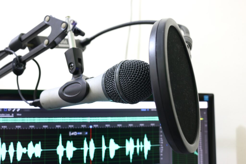 image of a recording setup with microphone and screen with sound bars  to show a podcasting location connected to the College, Disabilities, and Success podcast supporting students with disabilities planning college.
