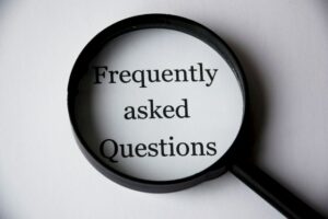 magnifying glass that shows frequently asked questions because modifications and accommodations come with many questions