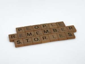scrabble letters spelling people remember stories